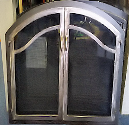 Horizon Wave Arch Black frame with natural iron twin doors with wave bar, standard forged handles and smoked glass. Comes with gate mesh door spark screens.